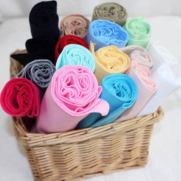 Knitted fabric rolls in many colours